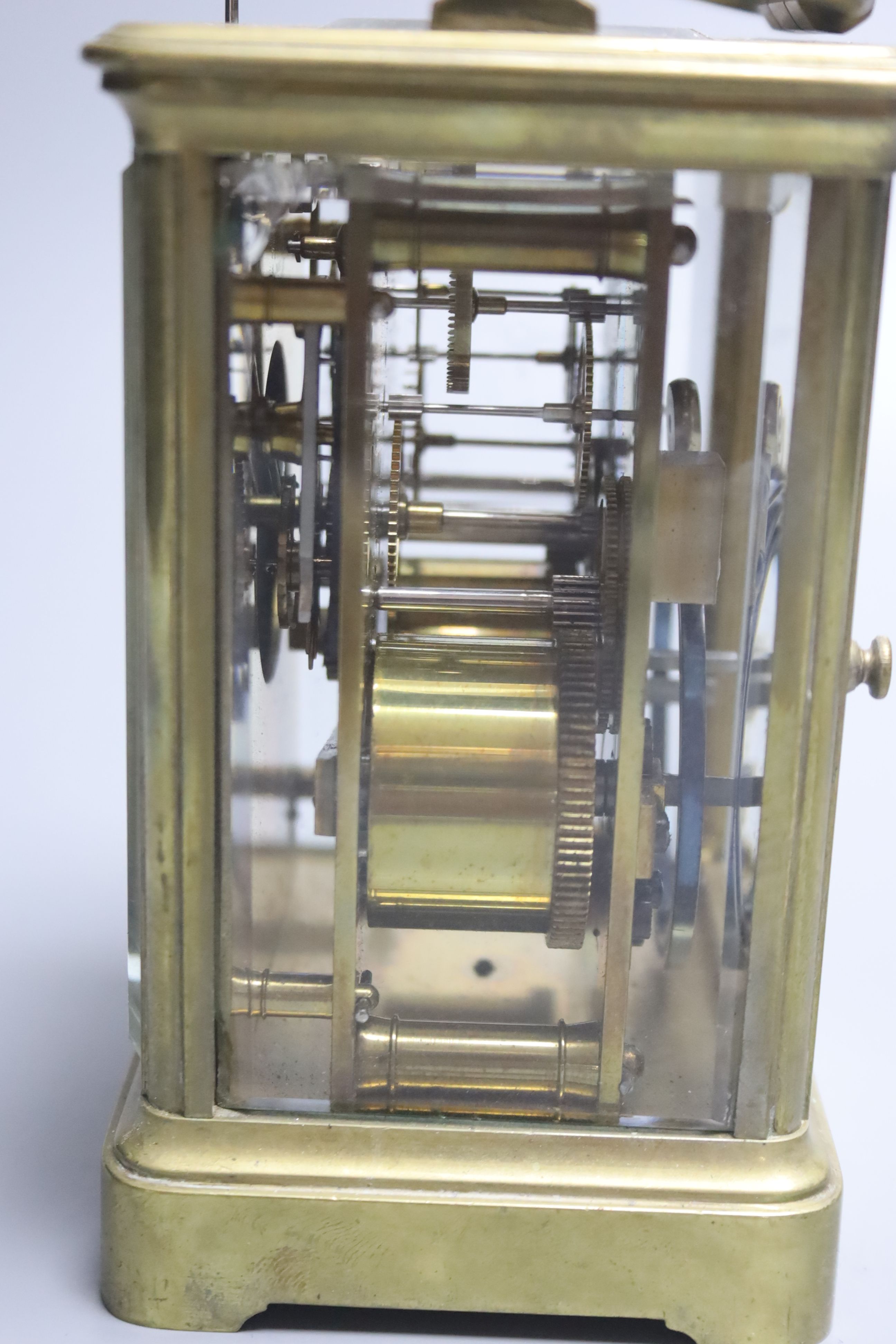 A 19th century brass hour repeating carriage clock, by Henri Jacot, height 15cm with handle down